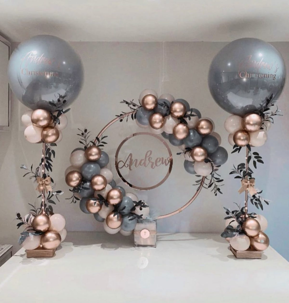 Custom balloon setup with garland and backdrop, featuring black and gold balloons for a styled birthday event in Melbourne