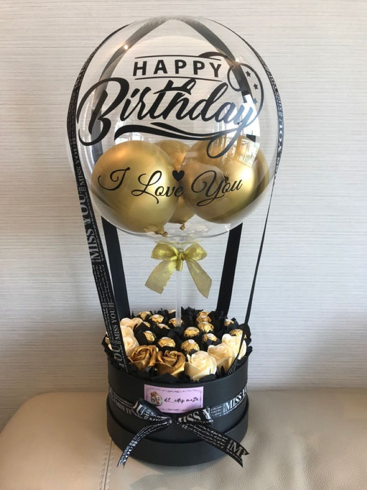 Birthday balloon gift box with gold balloons inside a transparent dome, styled for gifting in Melbourne